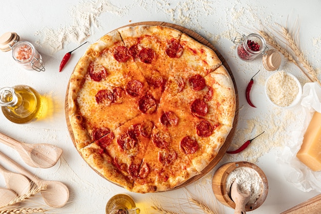 Fresh baked pepperoni pizza on white background