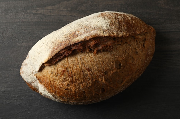 Fresh baked rye bread on black background