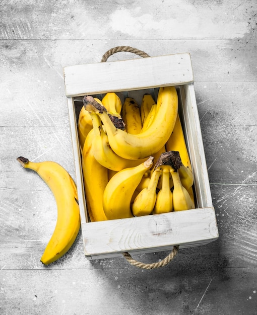 Fresh bananas in a wooden box