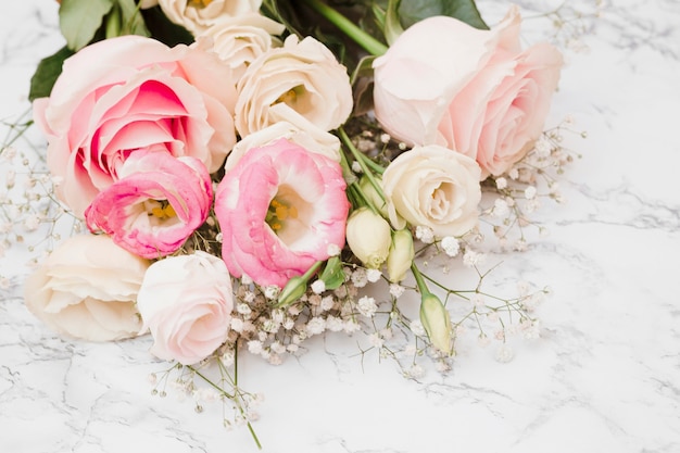 Fresh beautiful flower bouquet on marble textured background