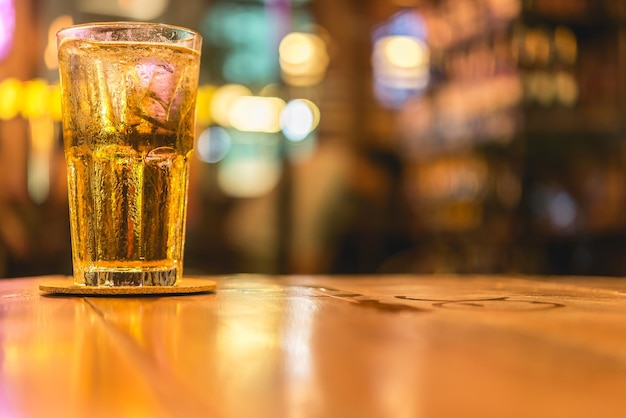 Fresh beer in glass at night scene on bokeh light backgroundtime for party