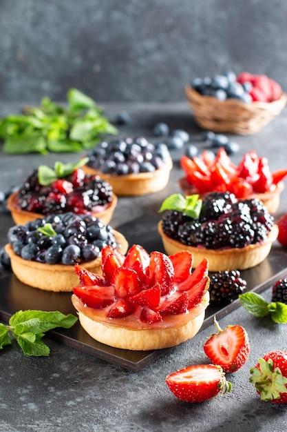 Fresh berries and ricotta cheese in tartletes Summer dessert healthy morning breakfast or snack o