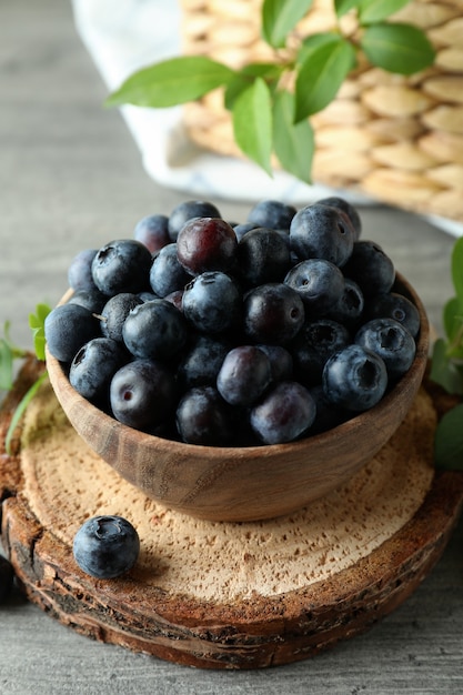 Fresh berry concept with blueberry on gray textured table