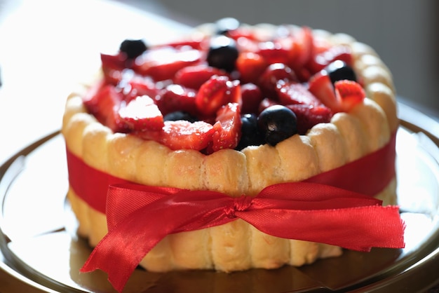 Fresh berry sweet fresh pie with red ribbon