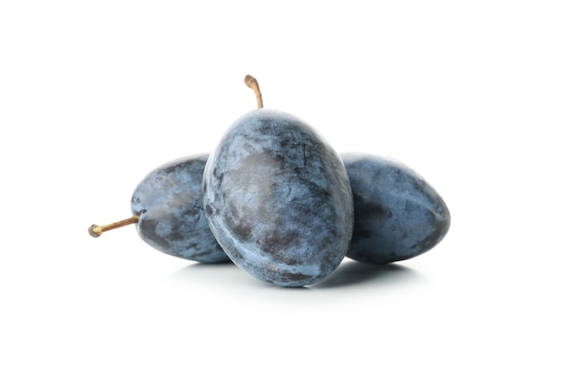 Fresh blue plums isolated on white