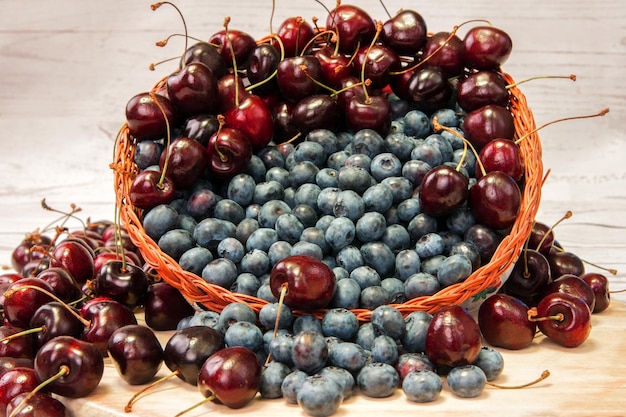 Fresh blueberries and cherries in basket