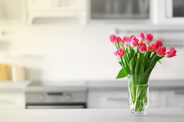 Fresh bouquet of tulips on a kitchen table