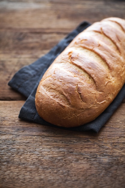 Fresh bread on a old rustic wooden table