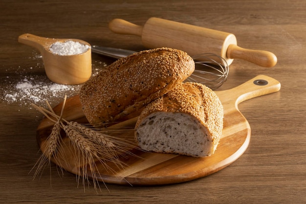 Fresh bread and wheat on the wooden