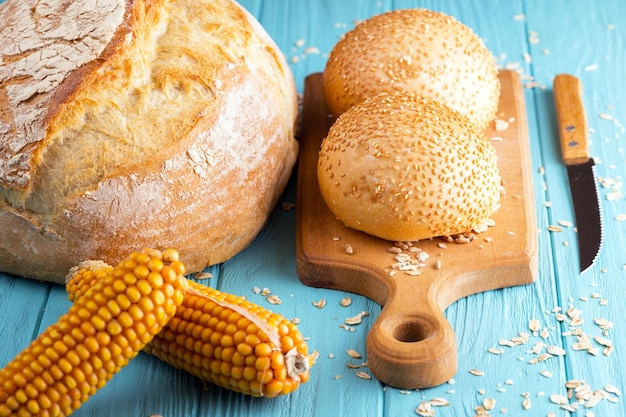 Fresh bread and wheat on the wooden