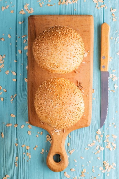 Fresh bread and wheat on the wooden