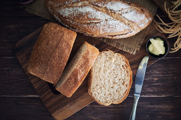 Fresh Bread On Wooden Table.