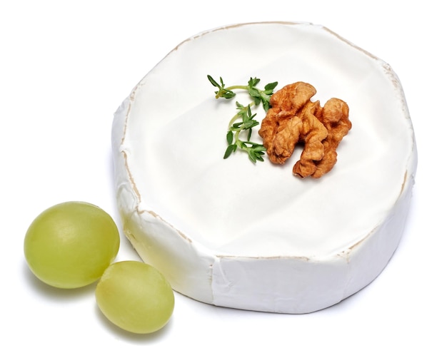 Fresh brie or camembert cheese isolated on a white background