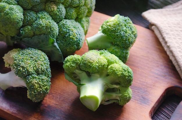 Fresh broccoli on the kitchen board