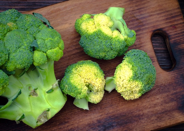 Fresh broccoli on the kitchen board