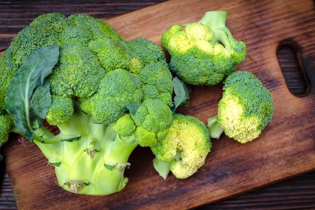 Fresh broccoli on the kitchen board