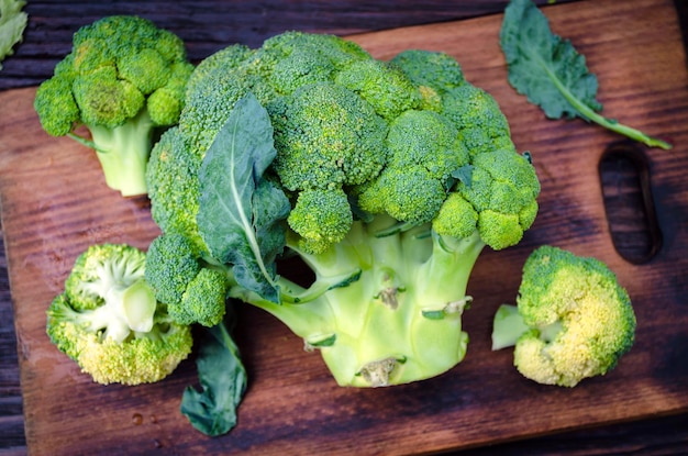 Fresh broccoli on the kitchen board