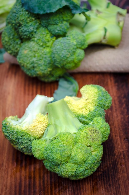 Fresh broccoli on the kitchen board