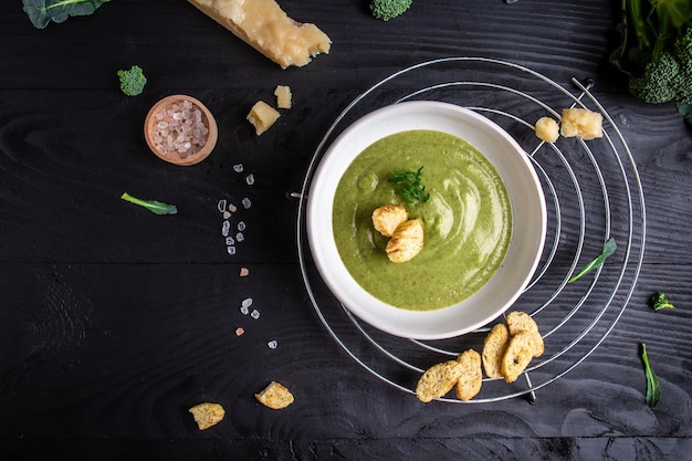 Fresh broccoli soup on bowl on wooden background Long banner format Vegetarian and diet food