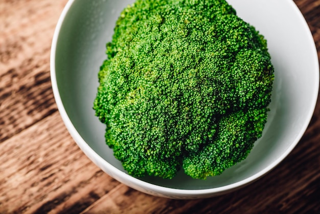 Fresh broccoli in white bowl