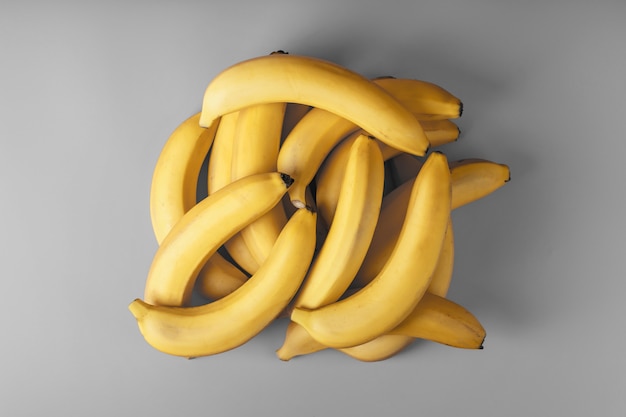 Fresh bunch of yellow bananas isolated on a Gray background