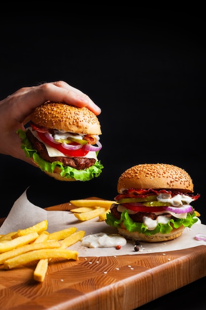 Fresh burgers on a black background