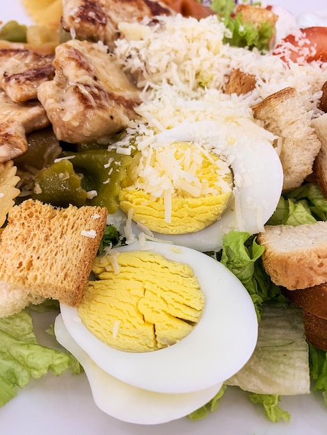 Fresh caesar salad with chicken close up caesar salad in home or dining room in healthy food concept