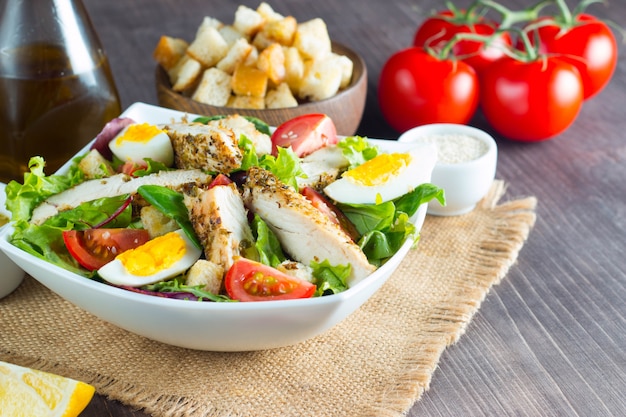 Fresh Caesar salad with delicious chicken breast