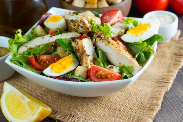 Fresh Caesar salad with delicious chicken breast