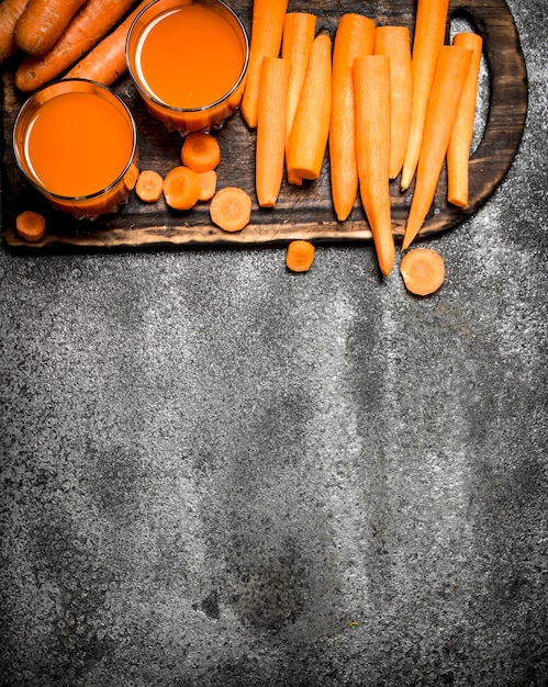 Fresh carrot juice on stone table