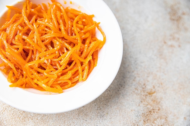 Fresh carrot salad vegetable healthy meal food snack on the table copy space food background veggie