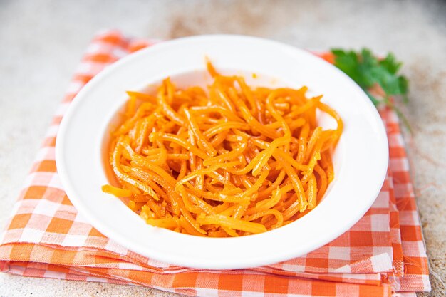 Fresh carrot salad vegetable healthy meal food snack on the table copy space food background veggie