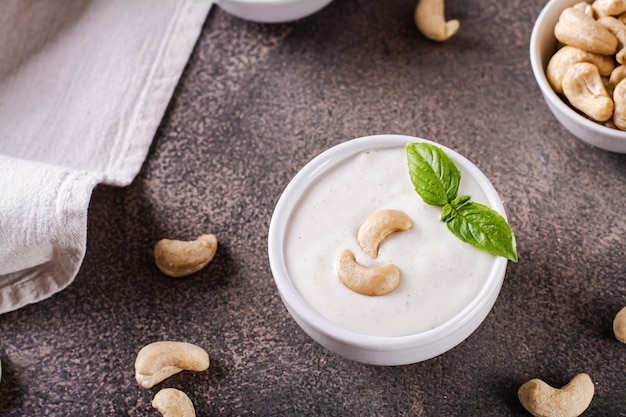 Fresh cashew sauce with basil in a bowl for a vegetarian diet