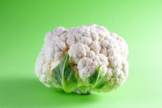 Fresh cauliflower on color background. Seasonal vegetables minimal style. Food in minimal style.