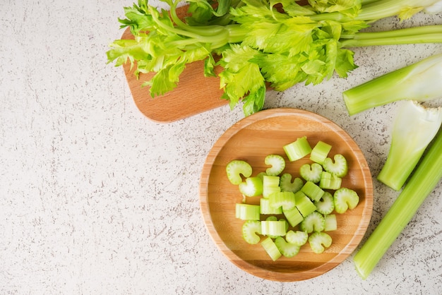 Fresh celery stalks cut into pieces for cooking , top view