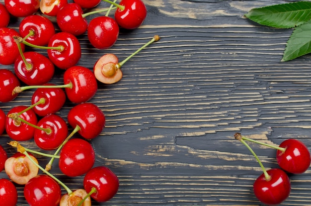 Fresh cherries on a wooden table. Selective focus. Top view