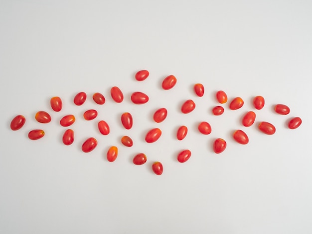 Fresh cherry tomatoes on white background