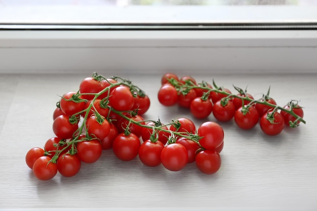 Fresh cherry tomatoes on windowsill