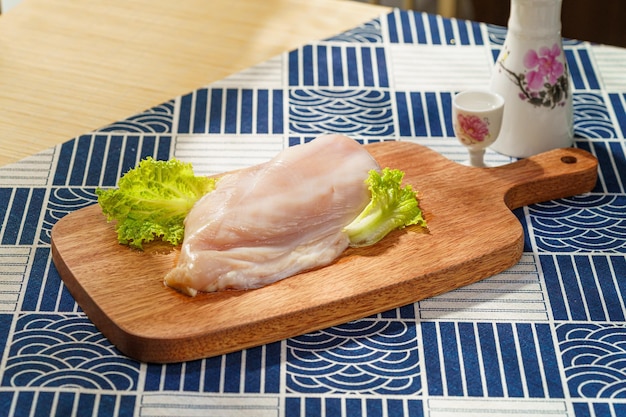 Fresh chicken breast on a simple background