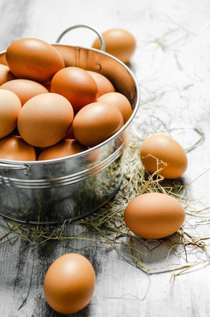 Fresh chicken eggs in a bucket