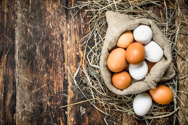 Fresh chicken eggs in an old bag.