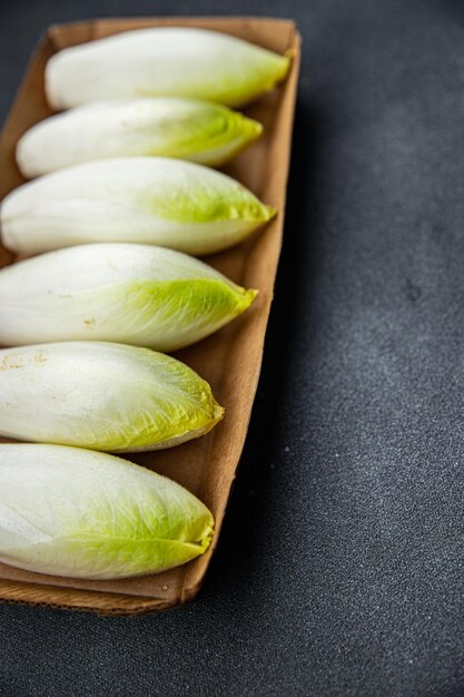 fresh chicory buds with petals healthy meal food snack on the table copy space food background