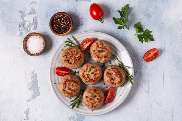 Fresh chiken cutlets with tomatoes and rosemary