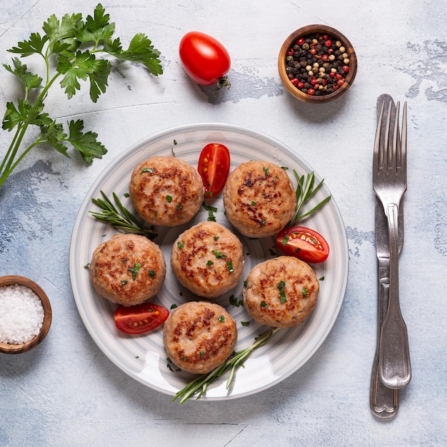 Fresh chiken cutlets with tomatoes and rosemary