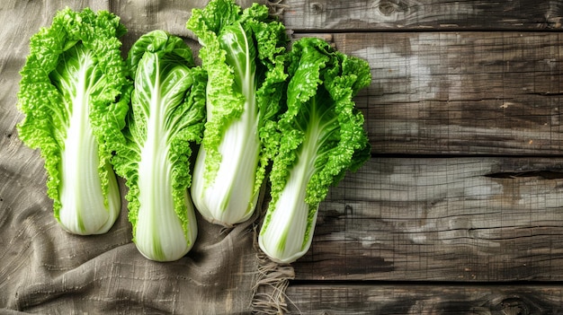 Fresh chinese cabbage on wooden surface top view of healthy vegetable on bleached board