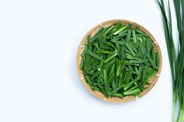 Fresh Chinese Chive leaves on white background.