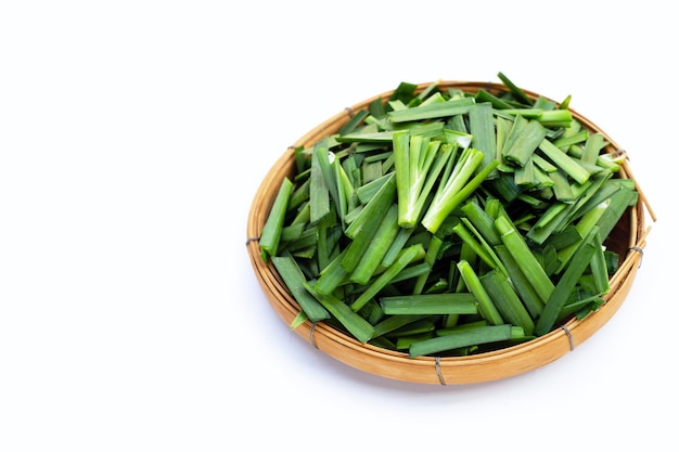 Fresh Chinese Chive leaves on white background