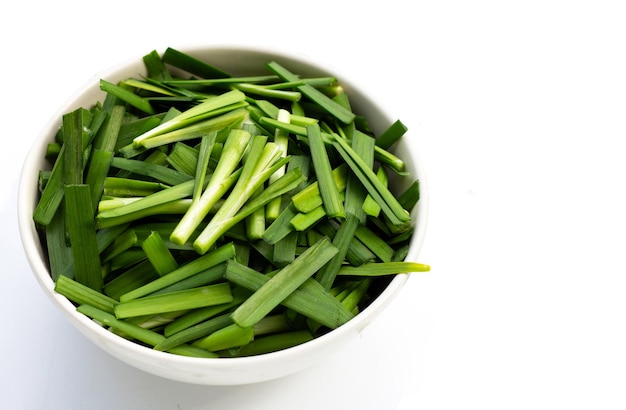 Fresh Chinese Chive leaves on white