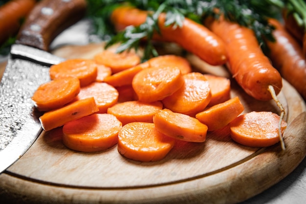 Fresh chopped carrots on a cutting board