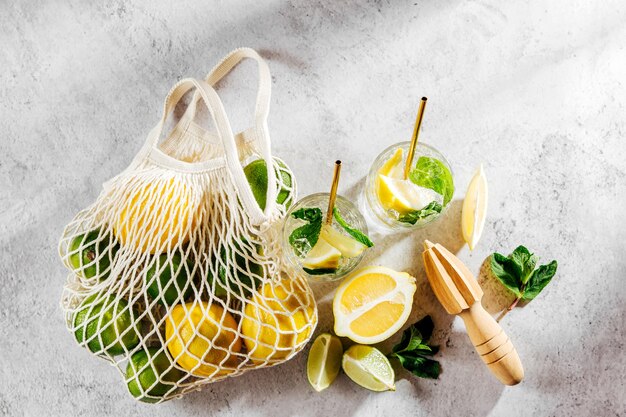 Fresh citrus lemonade with limes, lemons and mint. Summer drinks.